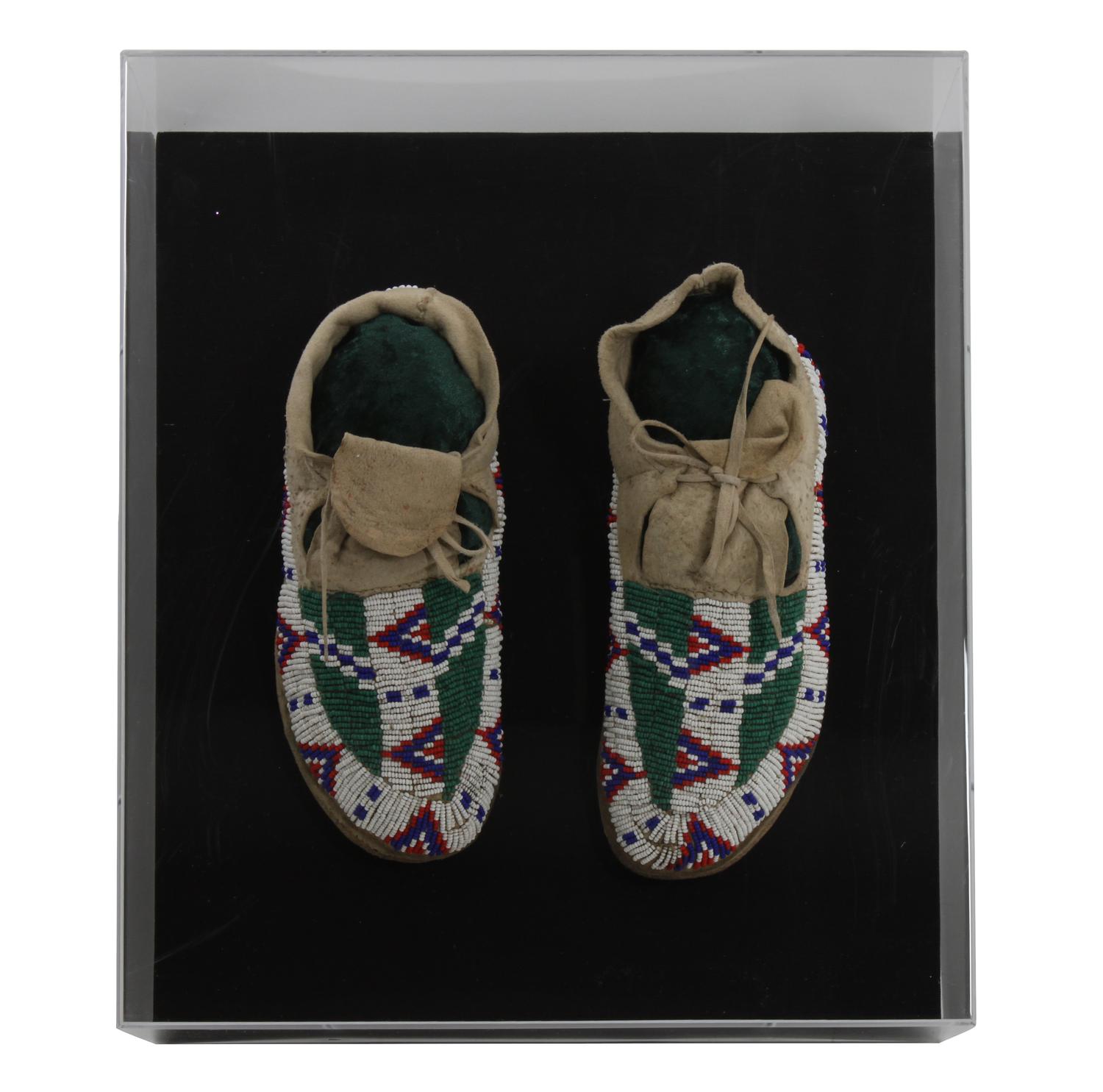 A Pair of Sioux Mocassins Length 9 1/2 inches — FIRST QUARTER 20TH CENTURY