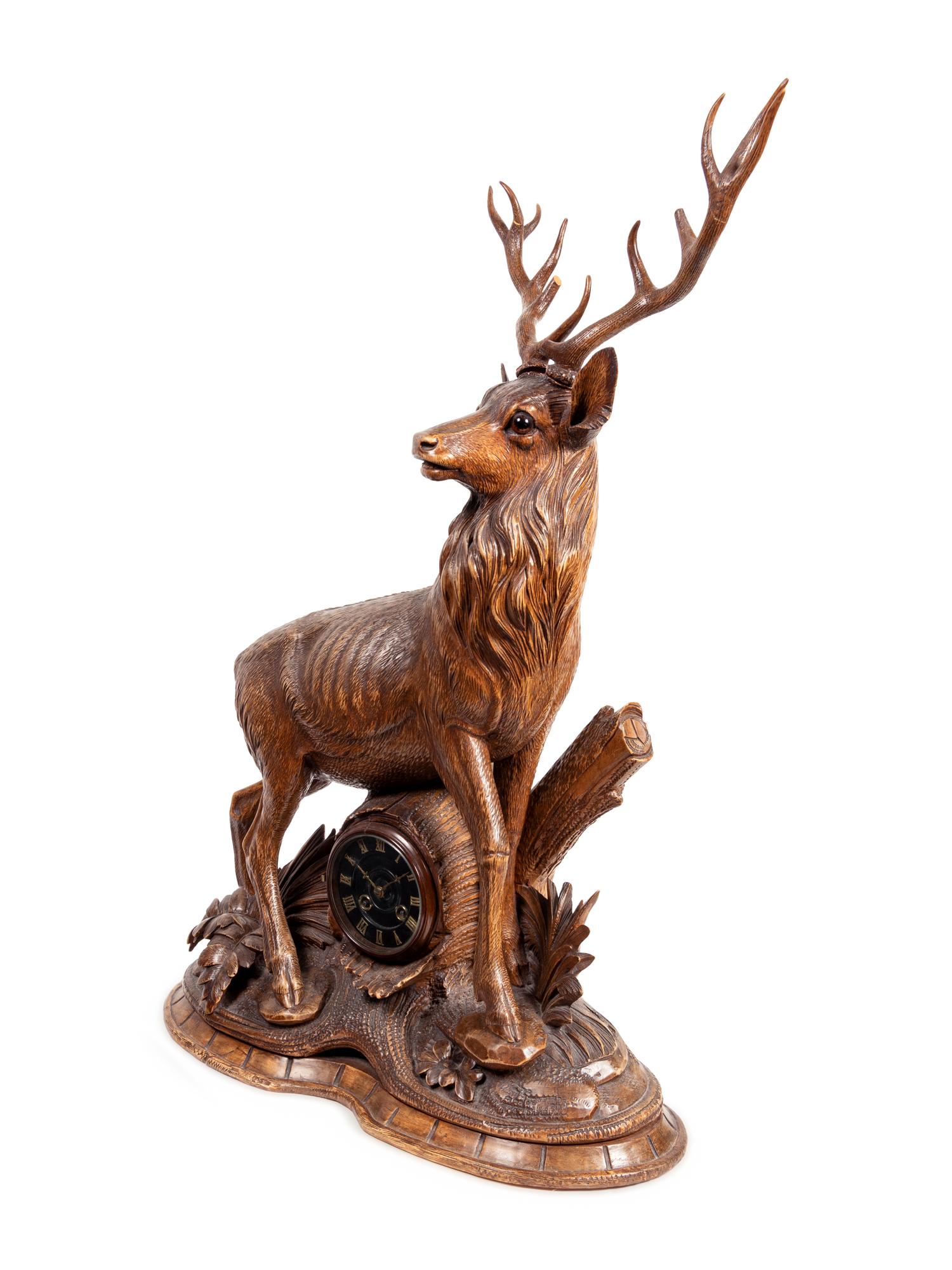 A Black Forest Carved Oak Stag-Form Mantel Clock