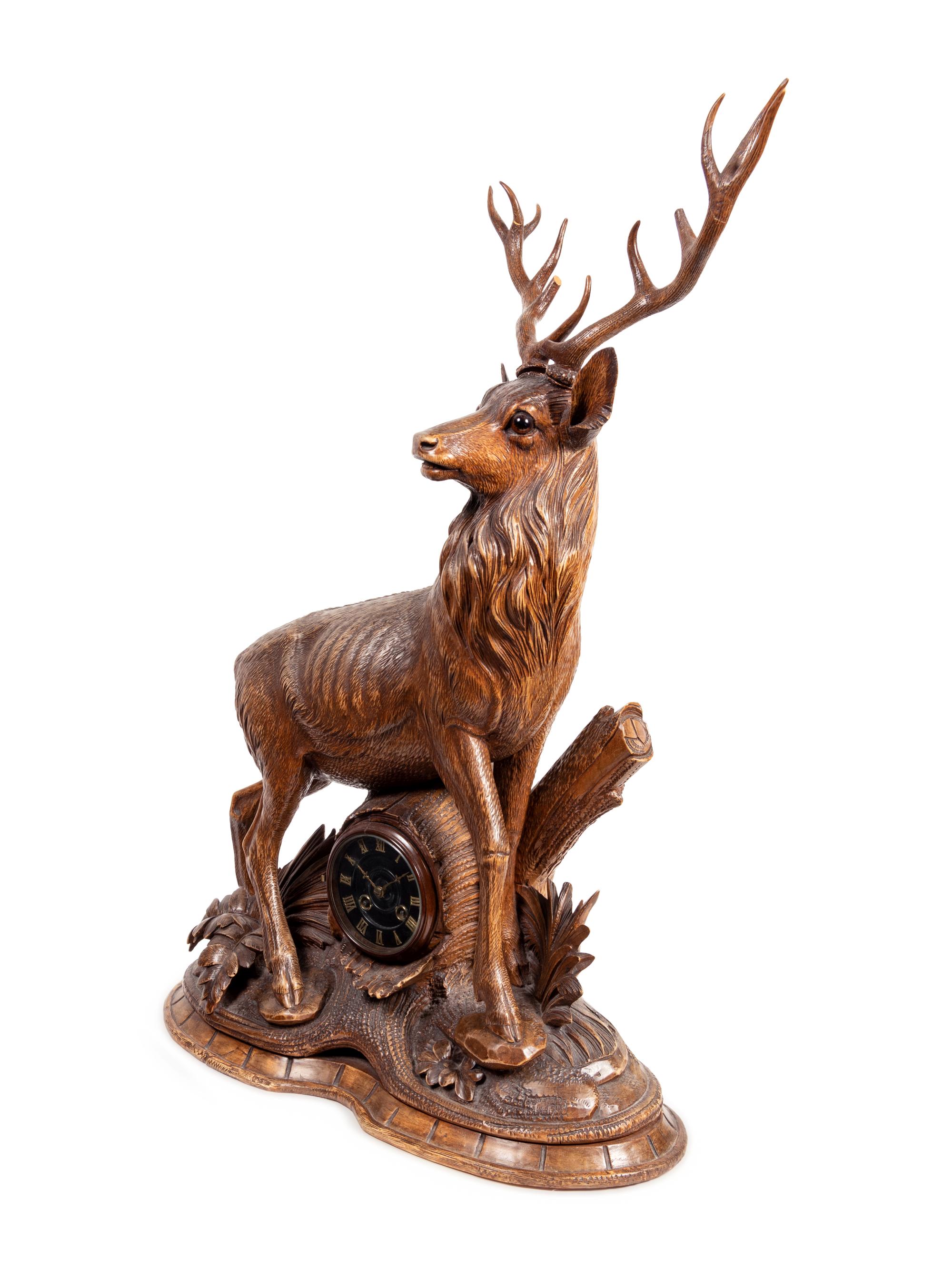 A Black Forest Carved Oak Stag-Form Mantel Clock