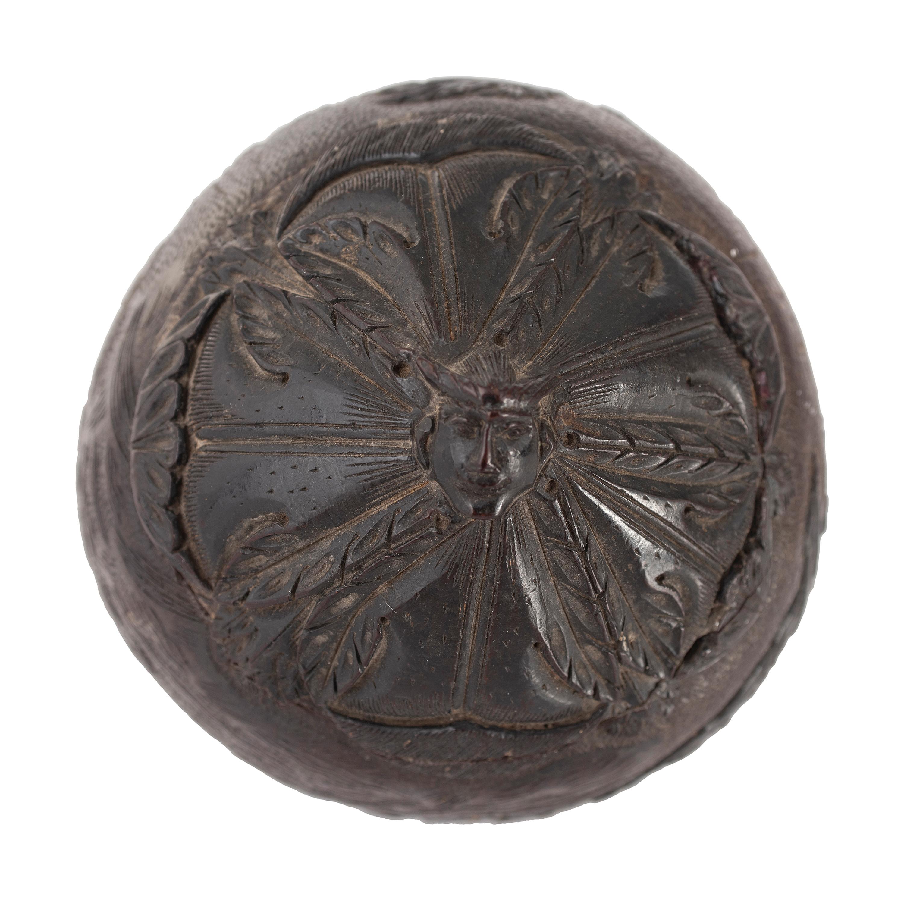 A Carved Coconut Depicting a Grisly American Indian Scene