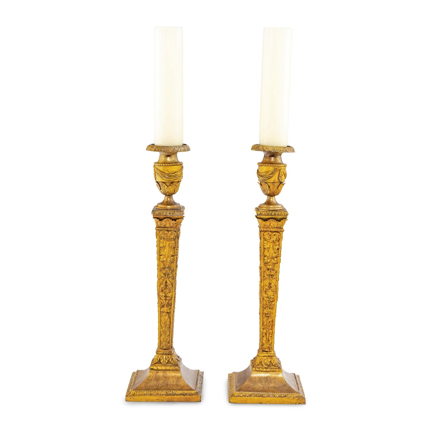 A Pair of Continental Gilt Iron Candlesticks