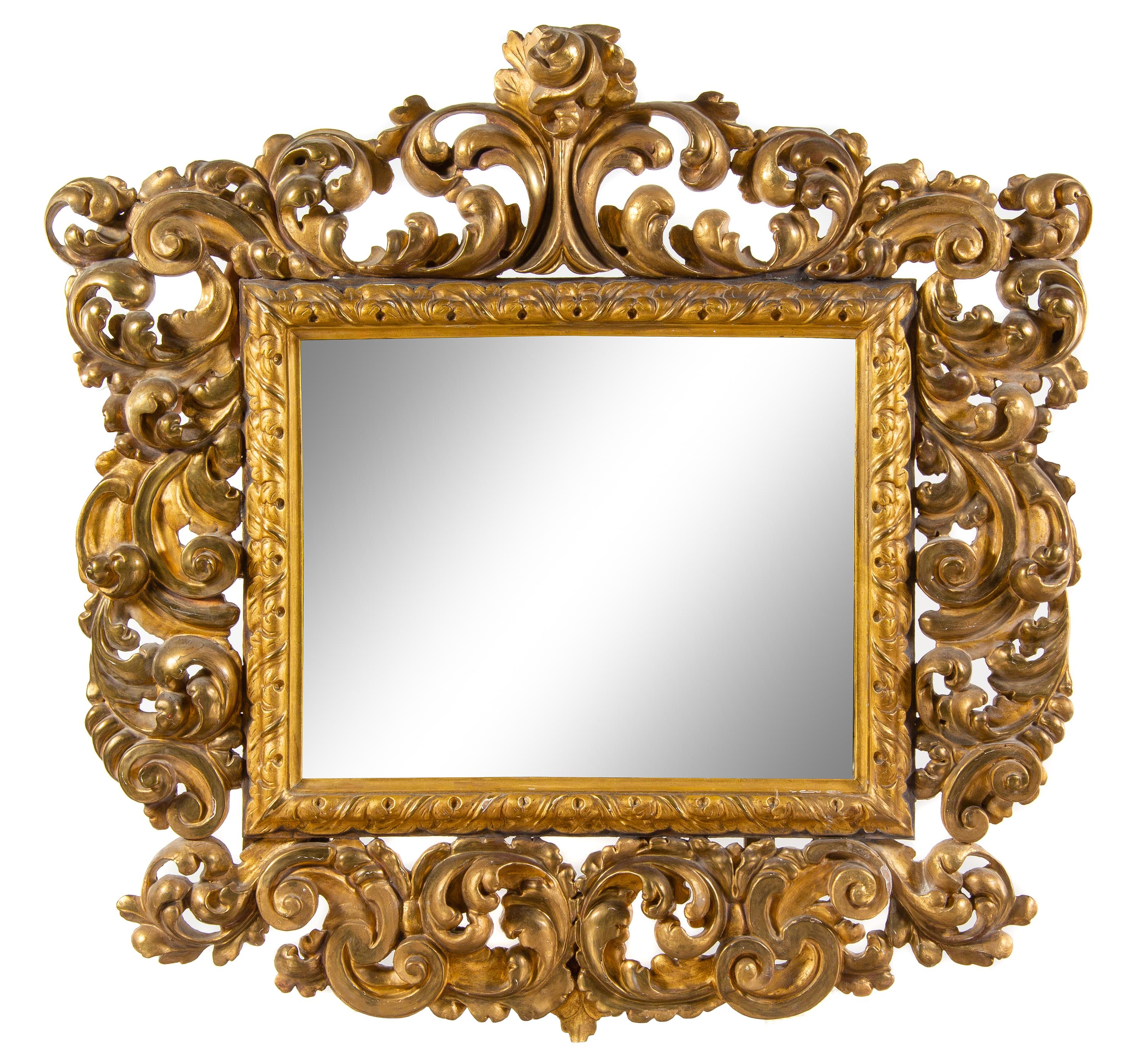 An Italian Baroque Style Giltwood Mirror Height 51 x width 52 inches. — 19TH CENTURY
