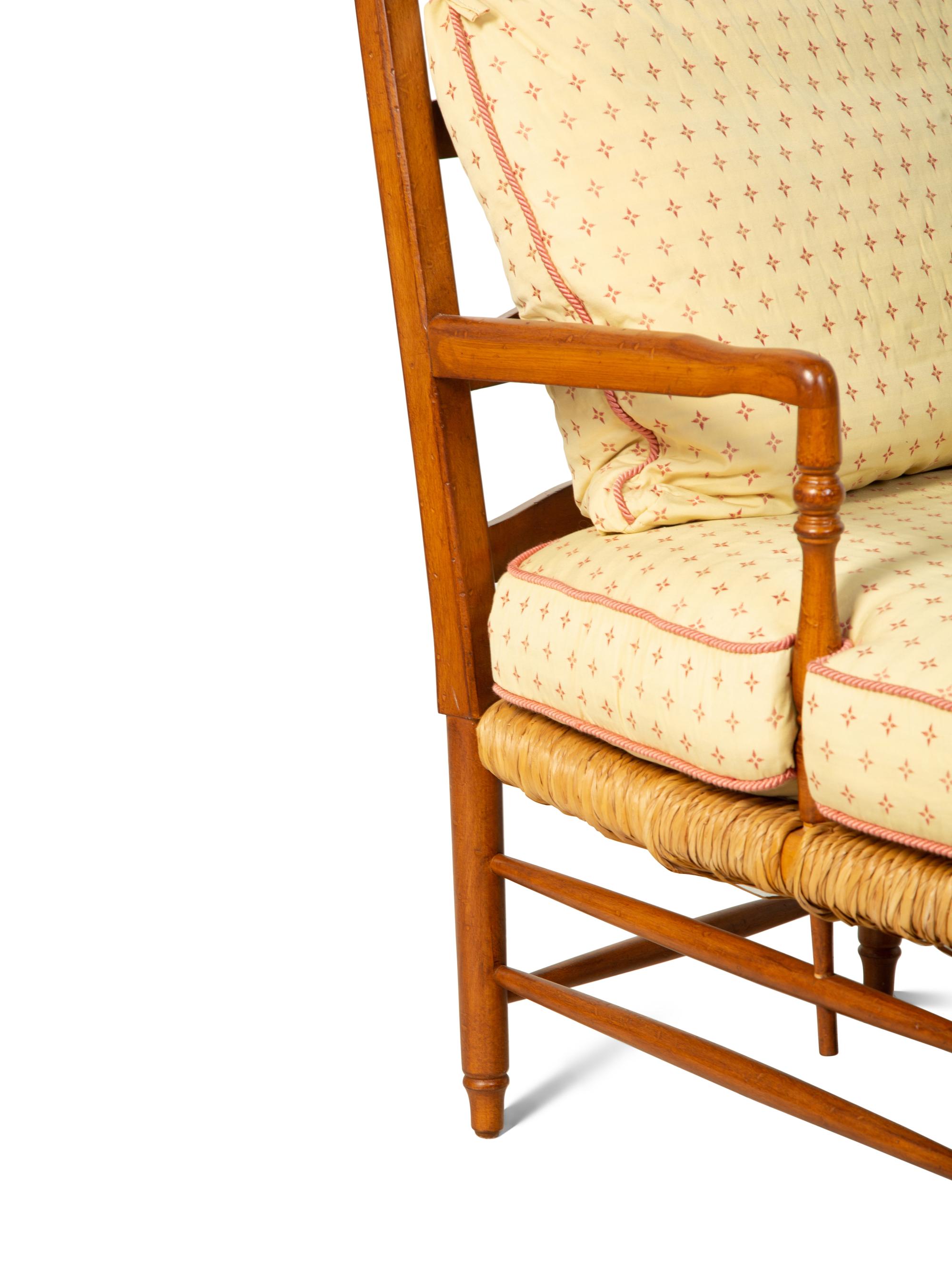 A Ladderback Armchair with Rush Seat and Ottoman — 20TH CENTURY