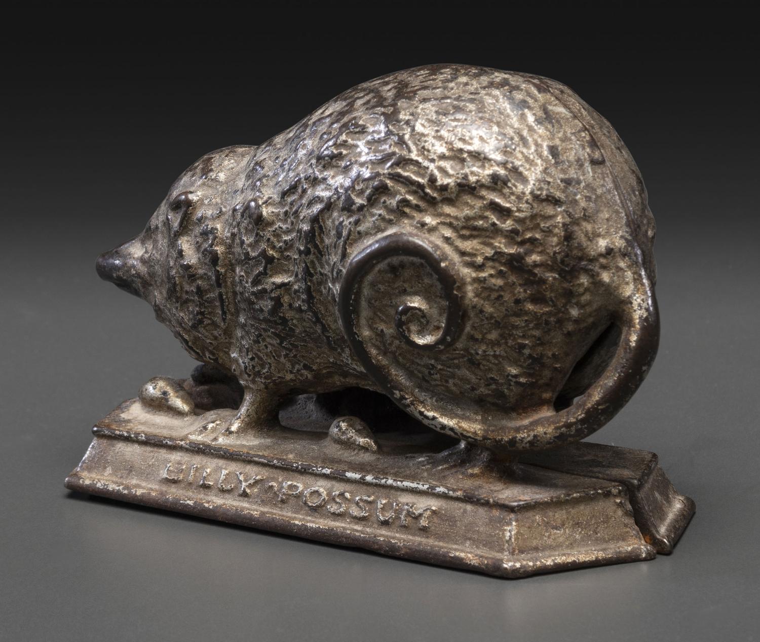 A 'Billy Possum' Cast Iron Still Bank