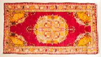 A Persian Wool Mat 5 feet 6 inches x 3 feet.