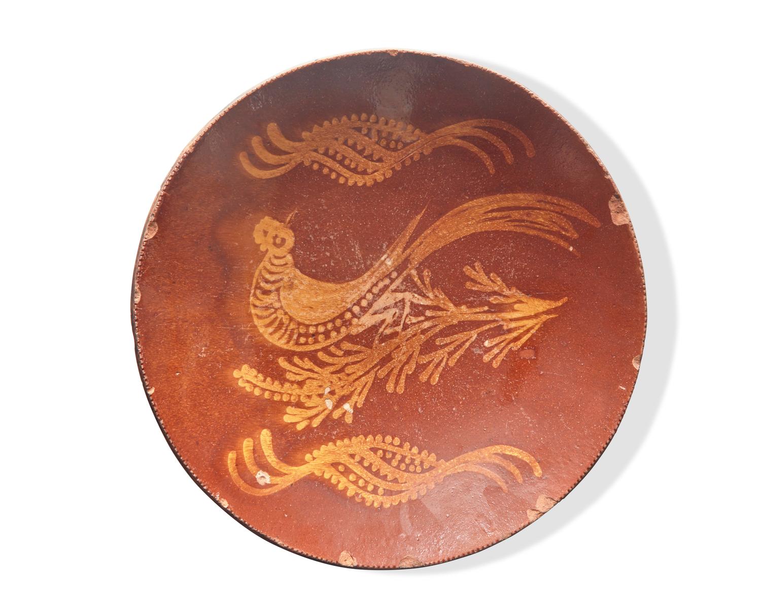A Glazed and Slip-Decorated Redware Charger, 19th Century