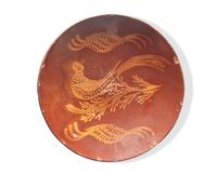 A Glazed and Slip-Decorated Redware Charger, 19th Century