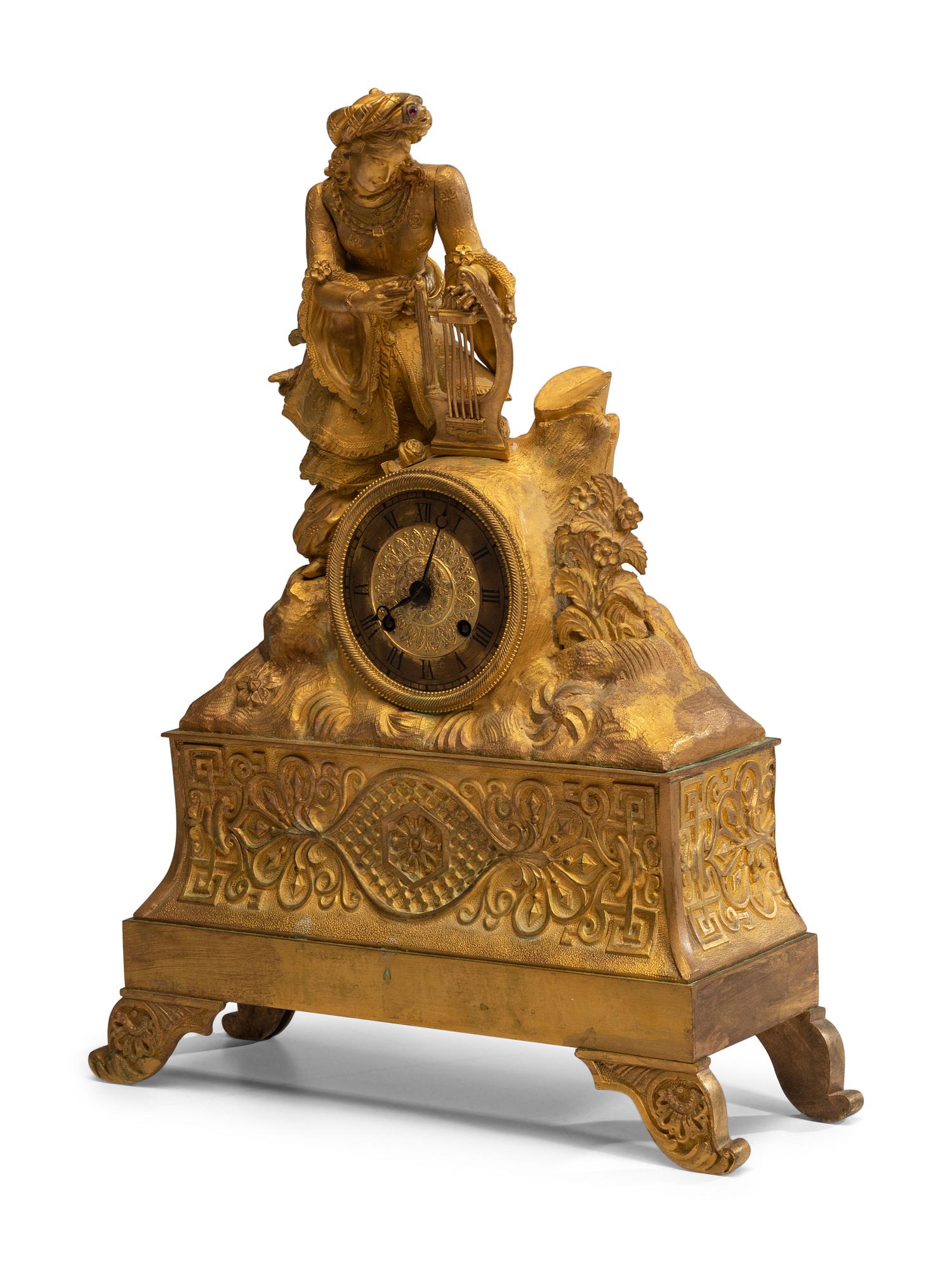 A Continental Gilt Metal Figural Mantel Clock