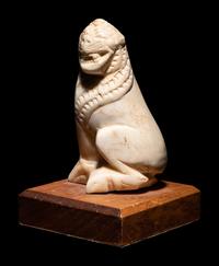 An Alabaster Seated Lion