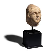 A Roman Marble Head of a Man Wearing a Phyrigian Cap
