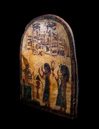 An Egyptian Painted Wood Round-Top Stele