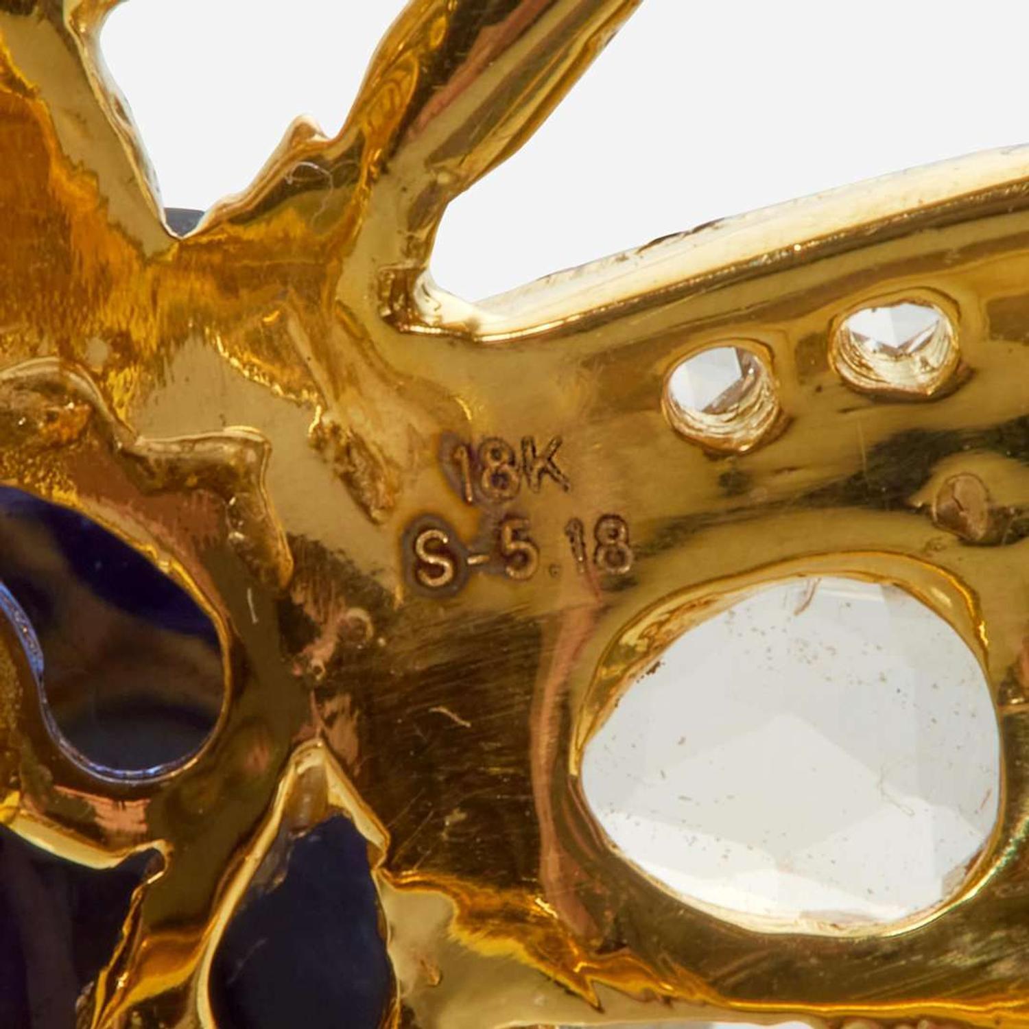 An 18K Yellow Gold, Sapphire, and Diamond Pin