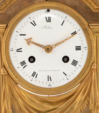 A Louis XVI Gilt Bronze Mantel Clock