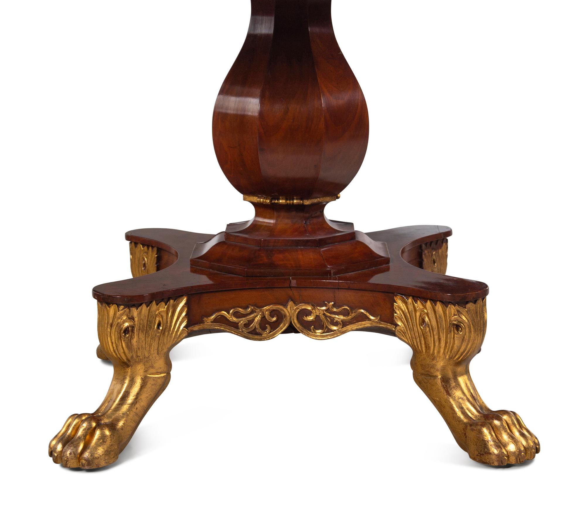 A Regency Parcel-Gilt Walnut Center Table