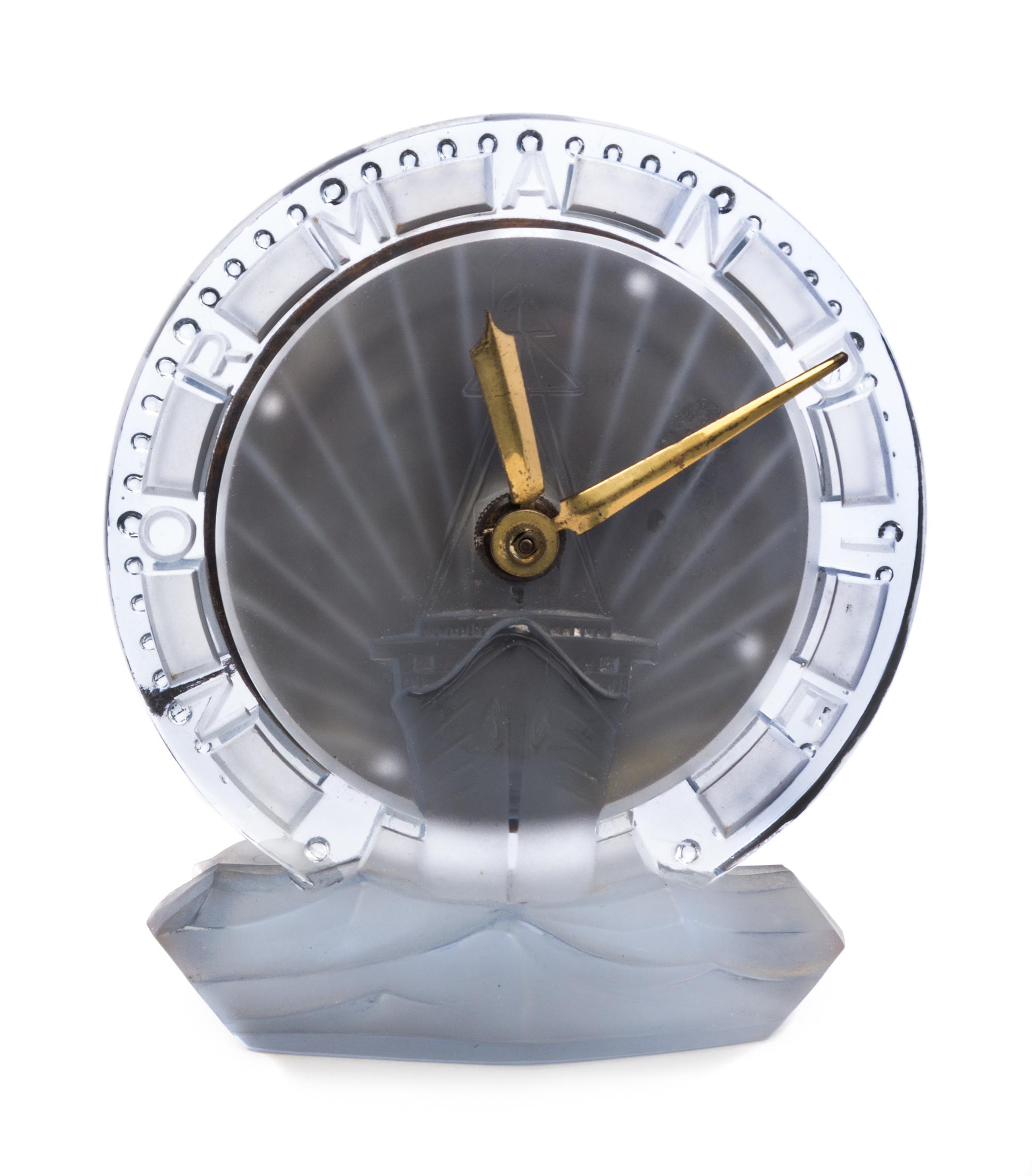 A French Frosted Glass Clock from the S.S. Normandie Height 6 inches. — PRODUCED BY ATO CLOCK CO. IN COLLABORATION WITH RENE LALIQUE, CIRCA 1935