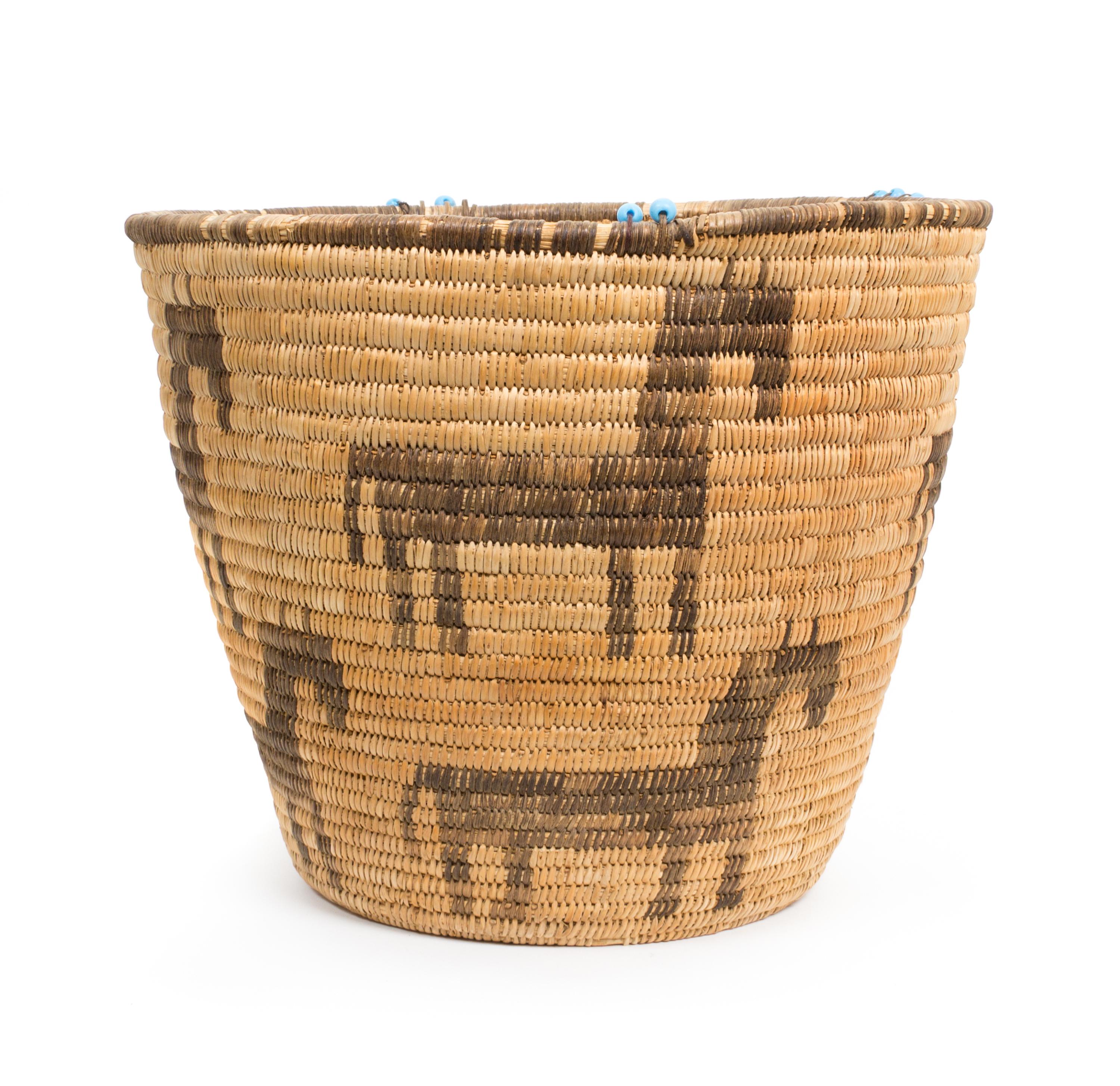 A Tohono O'odham Basket Height 10 3/4 x diameter 13 inches.