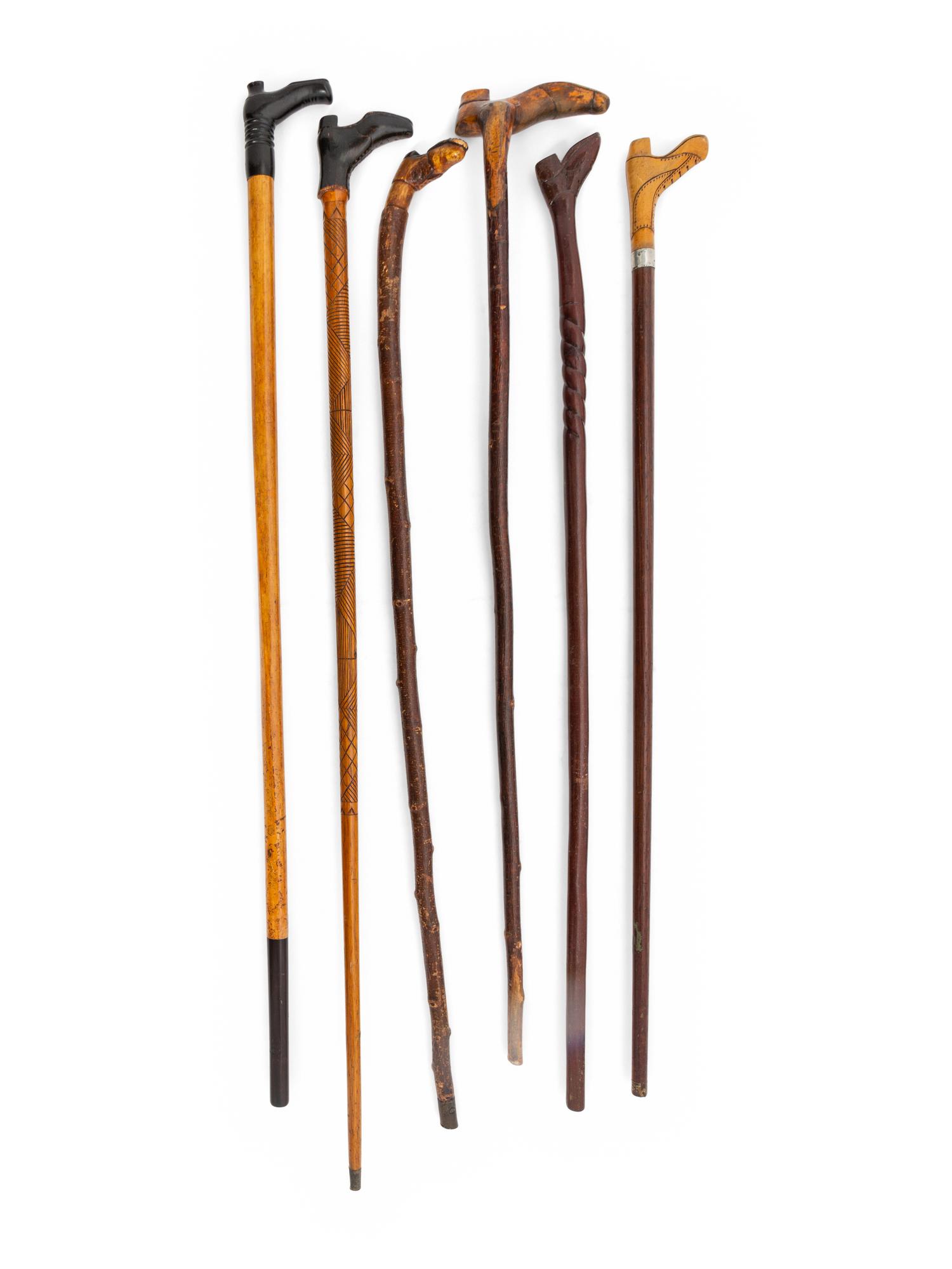 A Group of Folk Art Carved Shoe-Form Canes