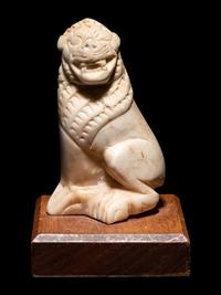 An Alabaster Seated Lion