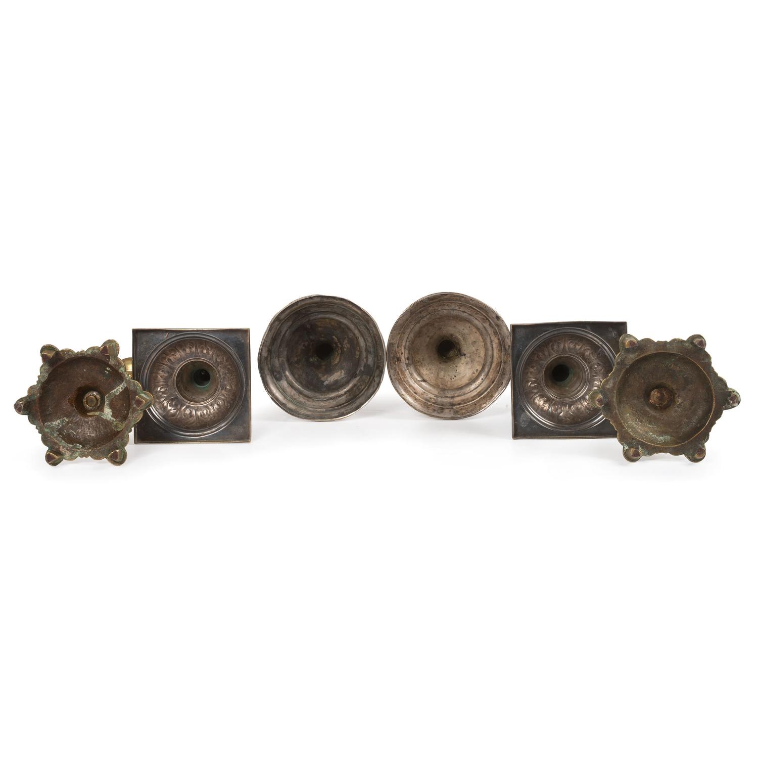 A Group of Continental Brass and Silverplated Candlesticks