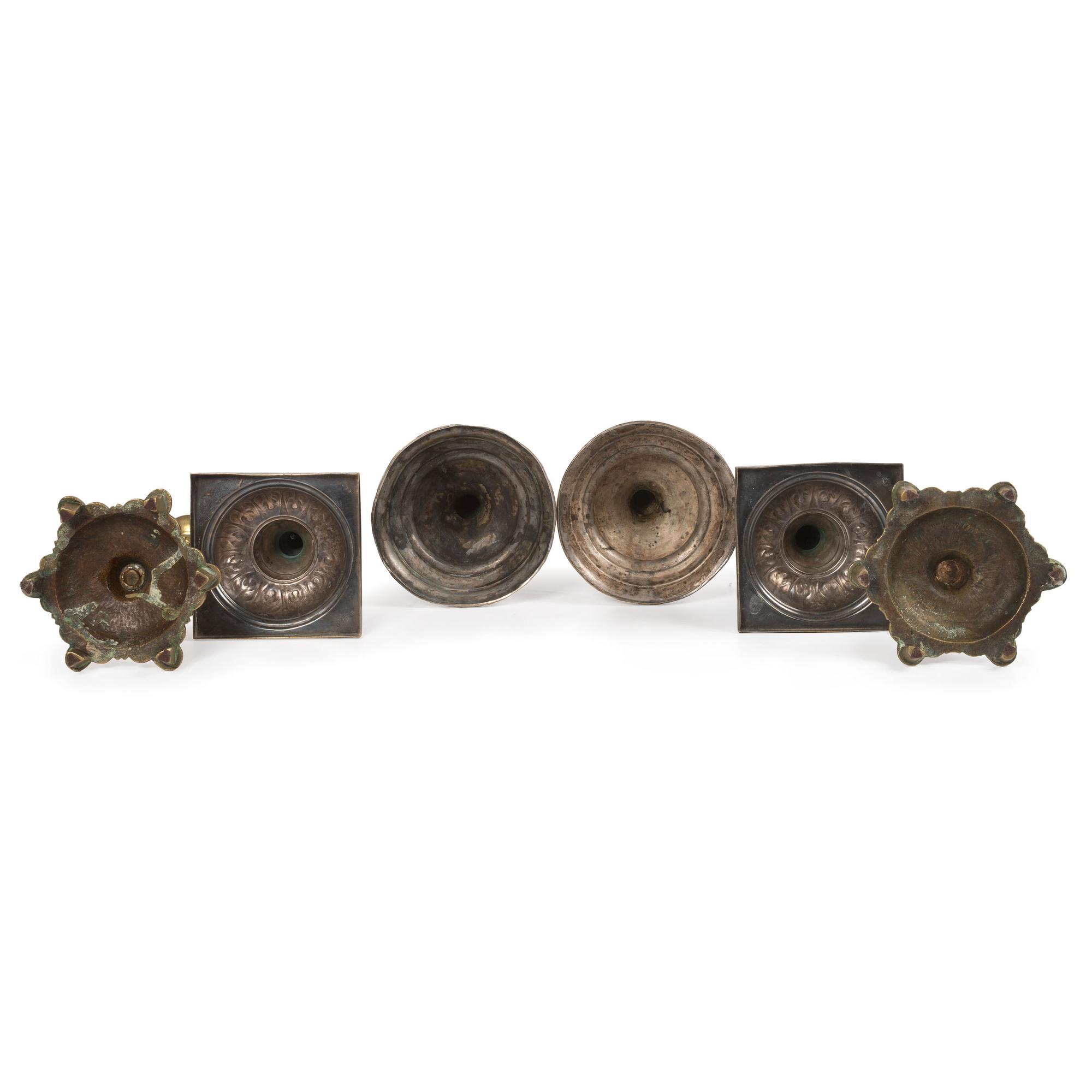 A Group of Continental Brass and Silverplated Candlesticks
