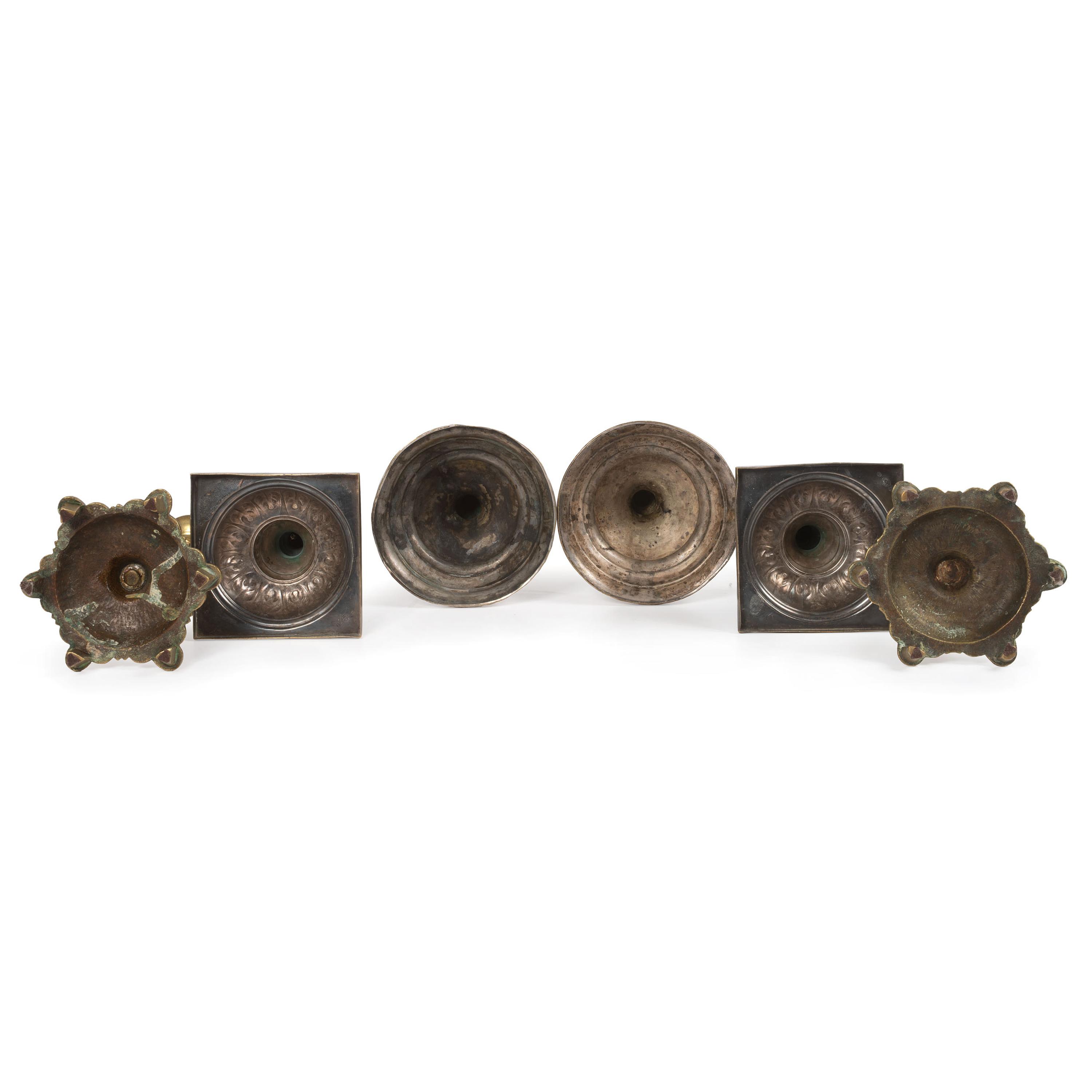 A Group of Continental Brass and Silverplated Candlesticks
