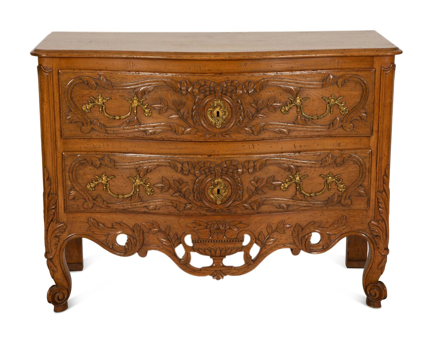 A French Provincial Carved Oak Commode