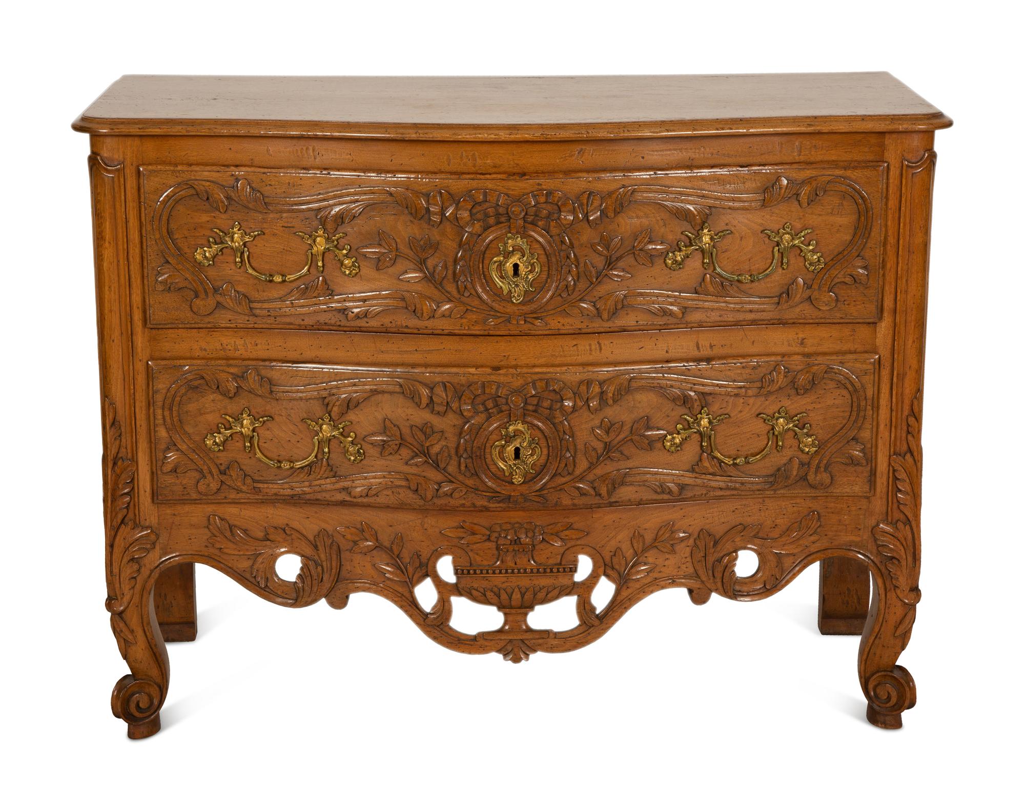 A French Provincial Carved Oak Commode