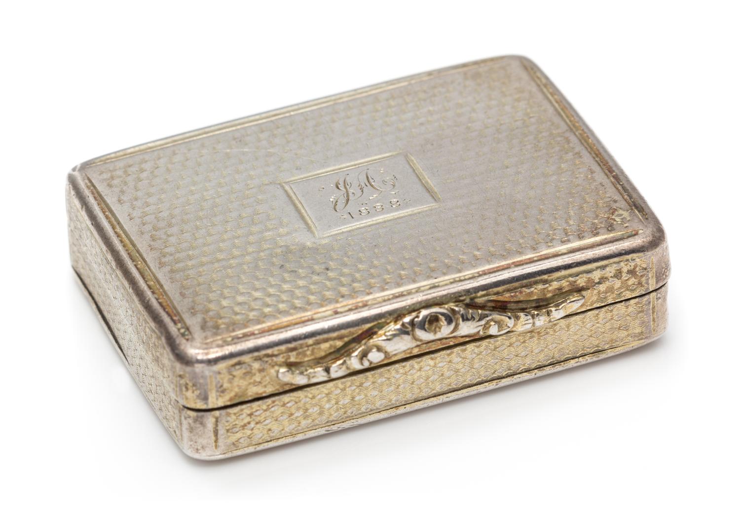 A William IV Silver Vinaigrette, Nathaniel Mills, Birmingham, 1840, having an engine turned case centered by a rectangular monogrammed
