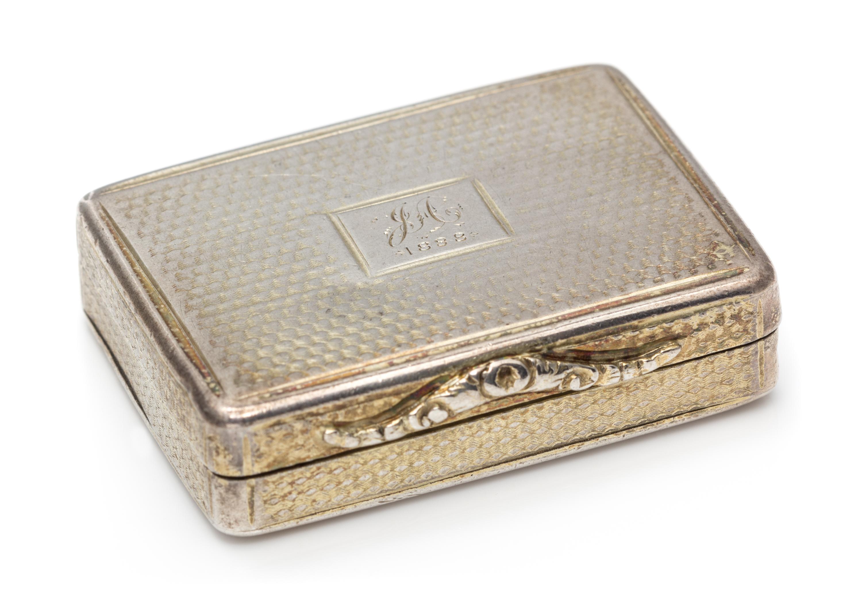 A William IV Silver Vinaigrette, Nathaniel Mills, Birmingham, 1840, having an engine turned case centered by a rectangular monogrammed