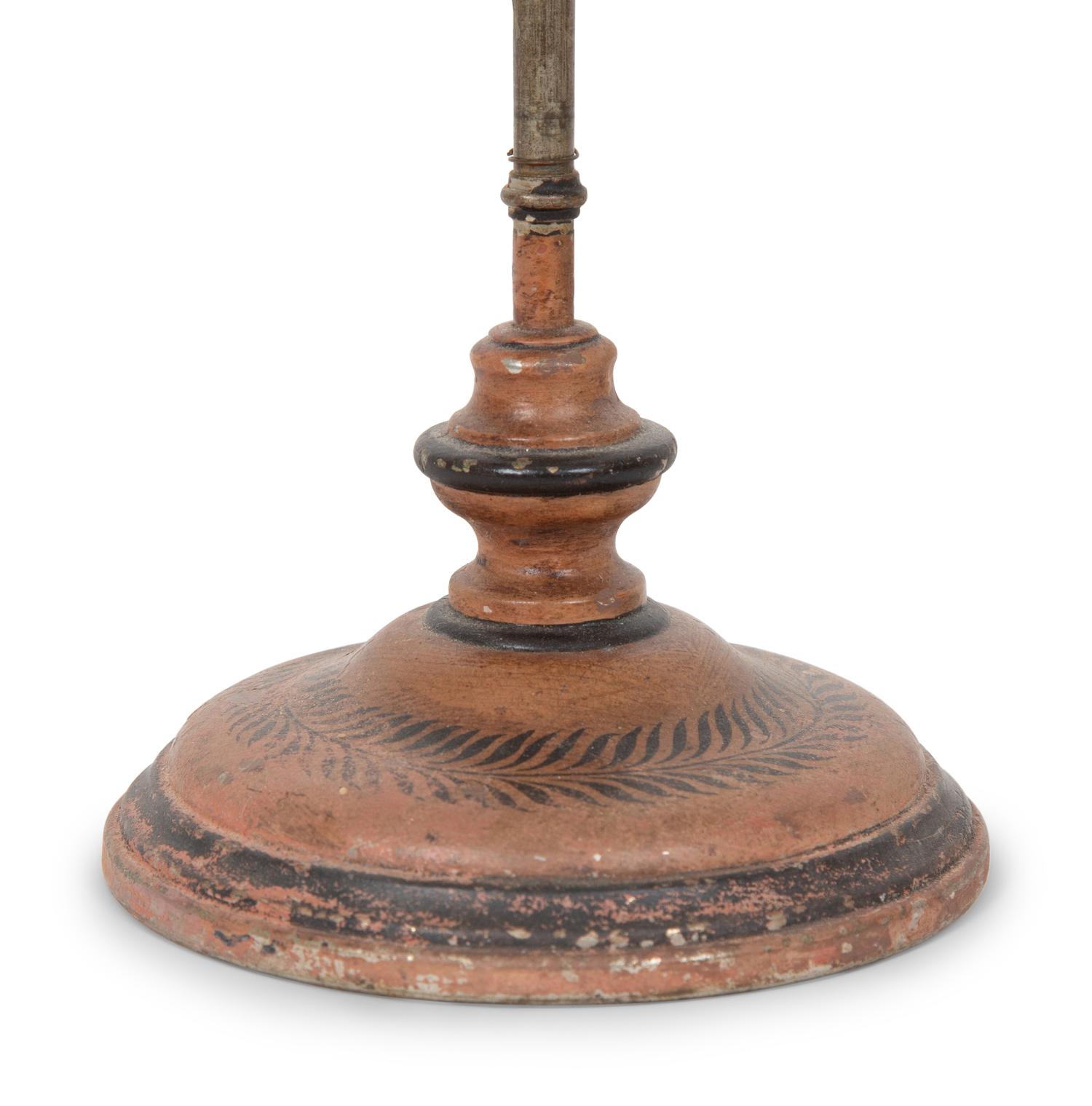 A French Tôle Peinte and Cast Iron Oil Lamp