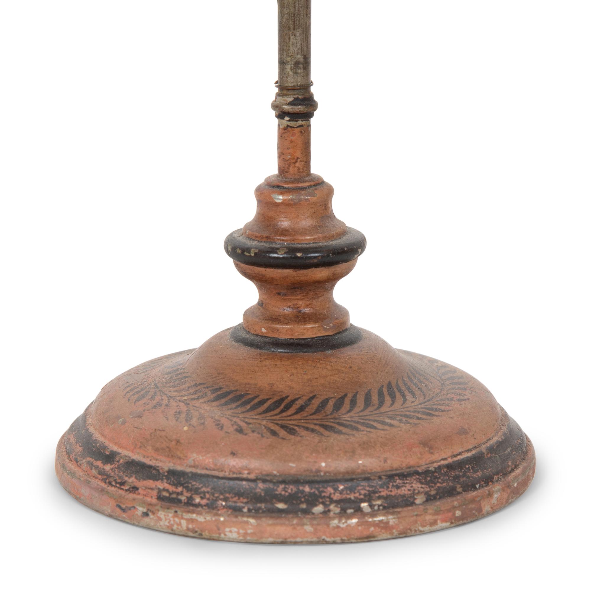 A French Tôle Peinte and Cast Iron Oil Lamp