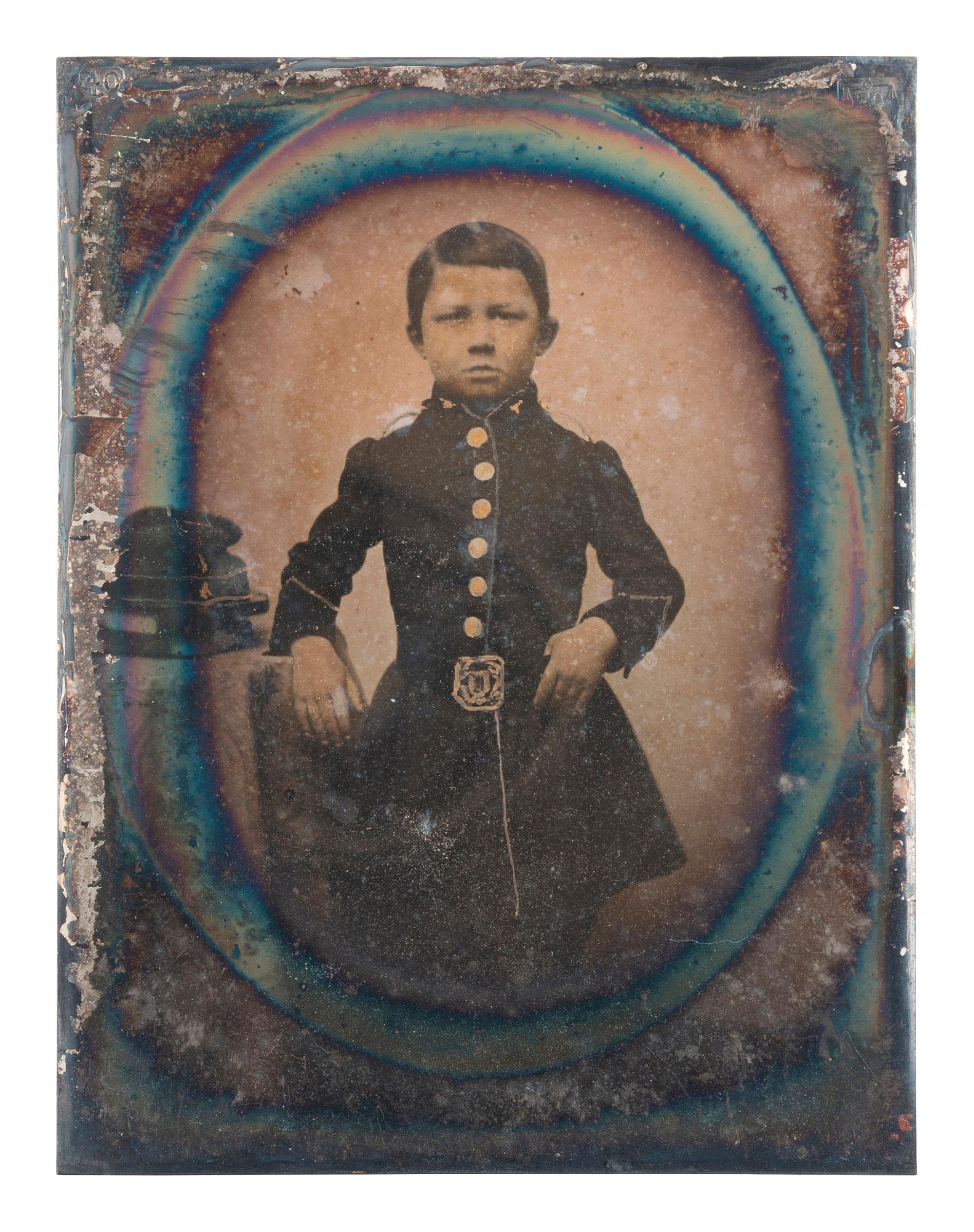 [EARLY PHOTOGRAPHY]. A pair of portraits of young boys dressed in military attire.