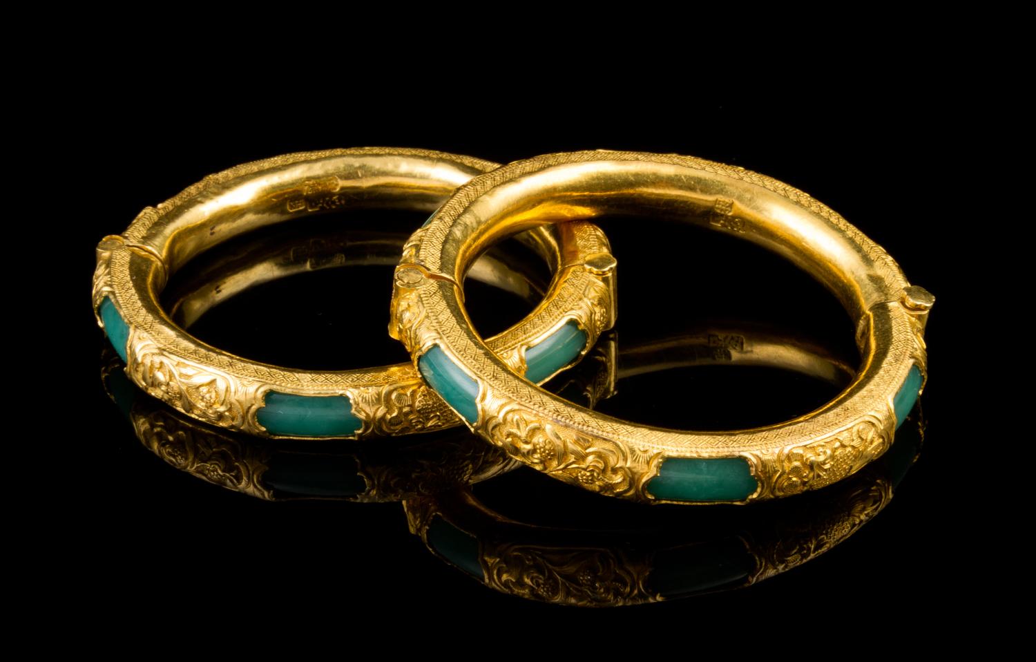 A Matched Pair of Chinese Gold Mounted Green Glass Bangles LATE QING DYNASTY Diameter: 2 inches. — LATE QING DYNASTY