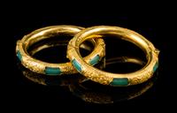 A Matched Pair of Chinese Gold Mounted Green Glass Bangles LATE QING DYNASTY Diameter: 2 inches. — LATE QING DYNASTY