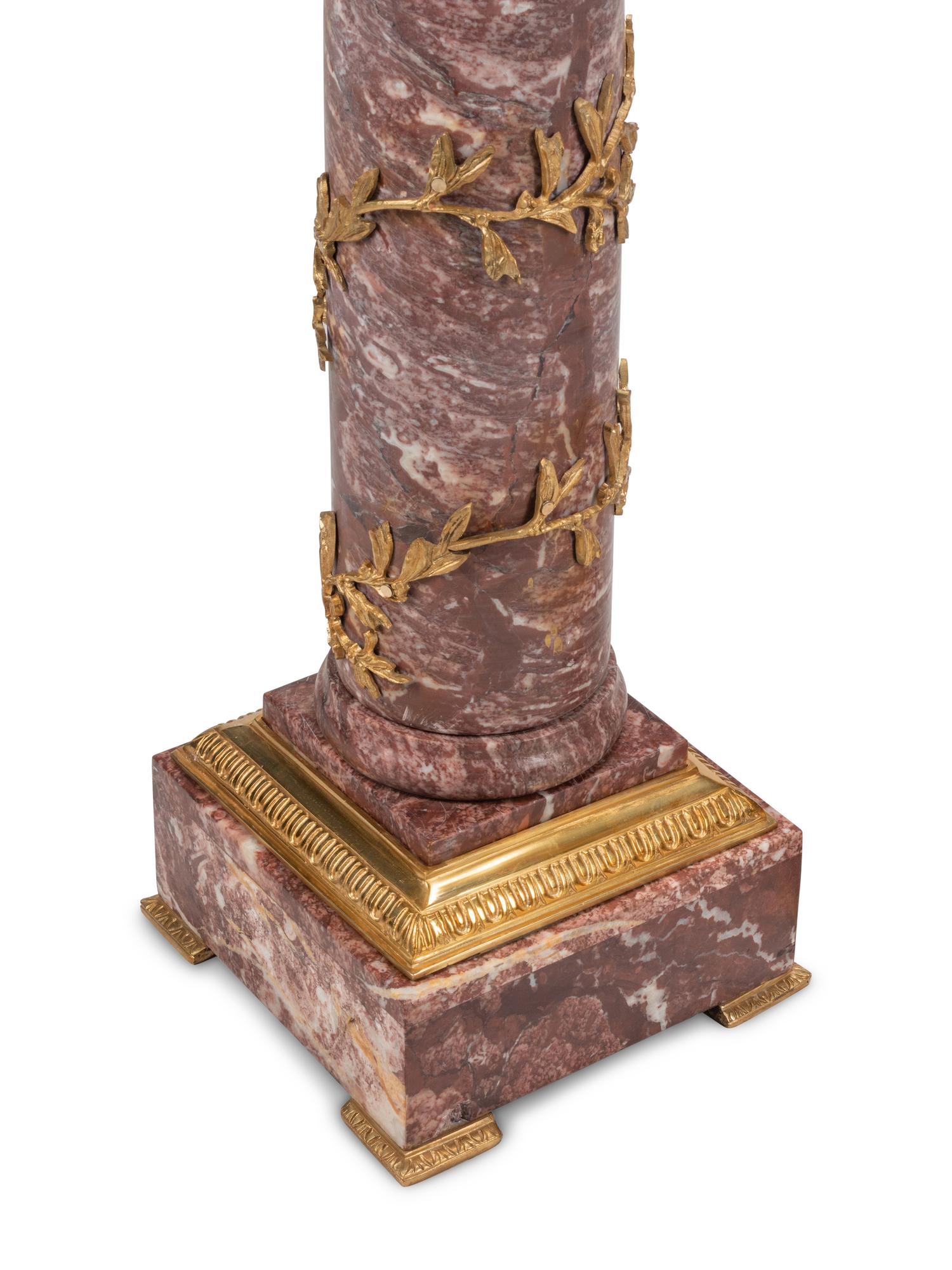 A Pair of Continental Gilt Bronze Mounted Marble Pedestals