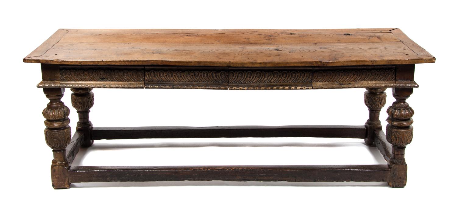 A Jacobean Style Oak Library Table, Height 30 3/4 x width 80 3/4 x depth 32 inches.