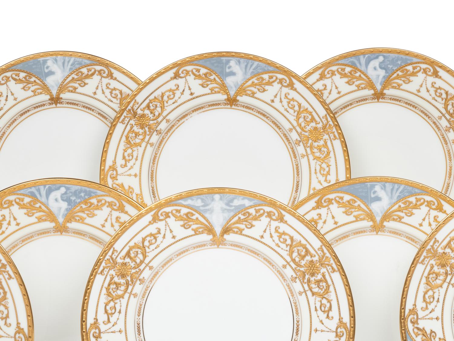 A Set of Twelve Mintons Pâte-sur-Pâte Parcel-Gilt Porcelain Plates