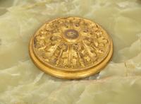 An Empire Style Patinated and Gilt Bronze Mounted Onyx Centerpiece