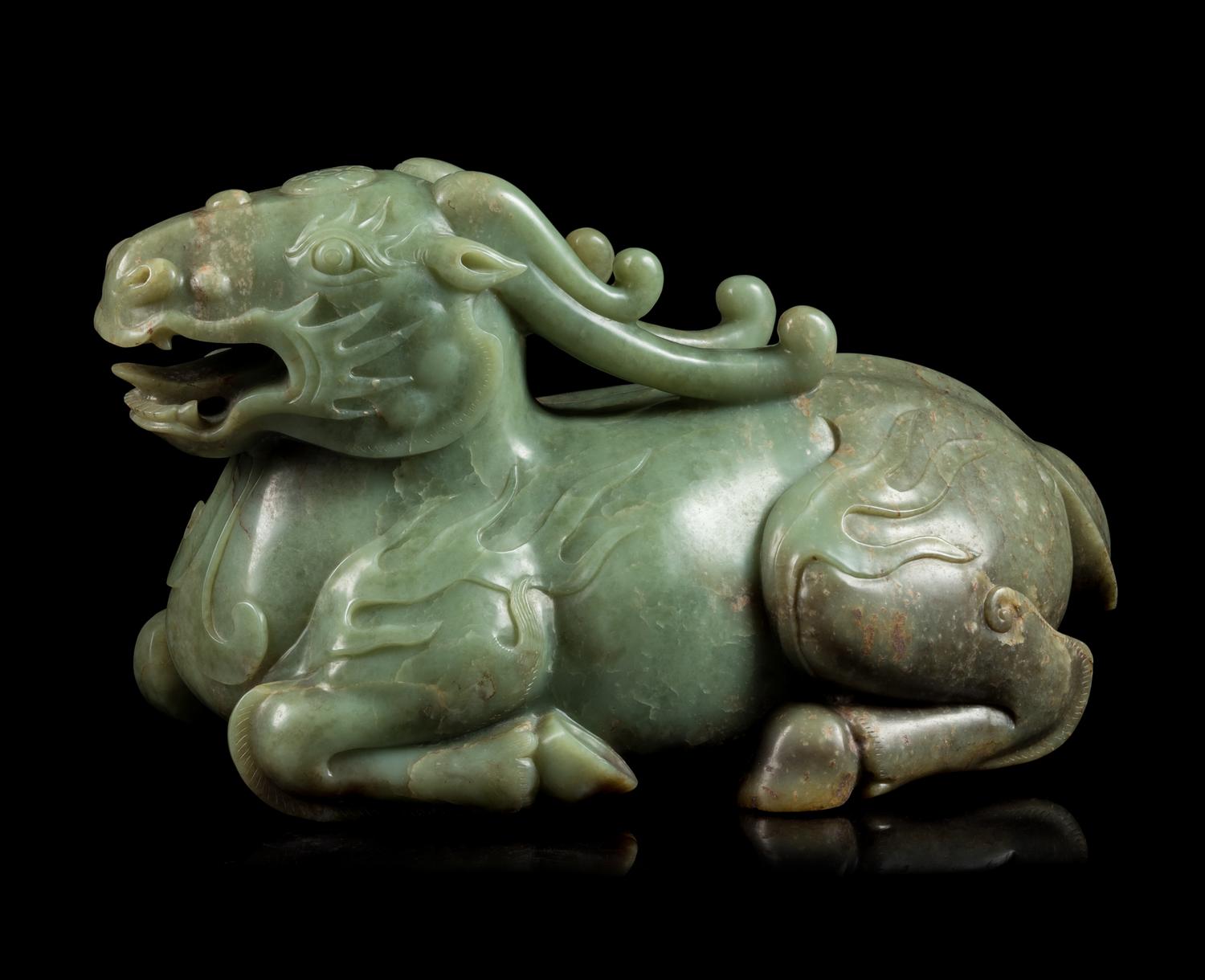 A Celadon Jade Figure of a Recumbent Qilin