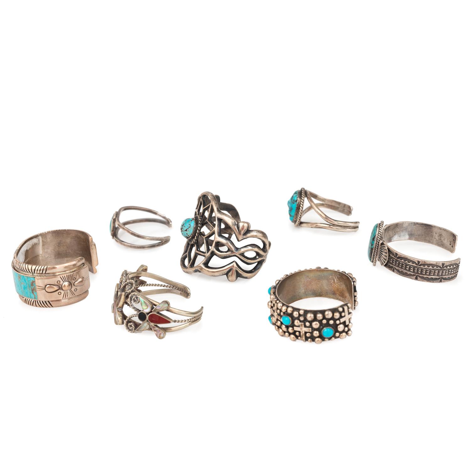 Selection of Navajo, Hopi, and Zuni Silver Bracelets and Earrings, with Inlay