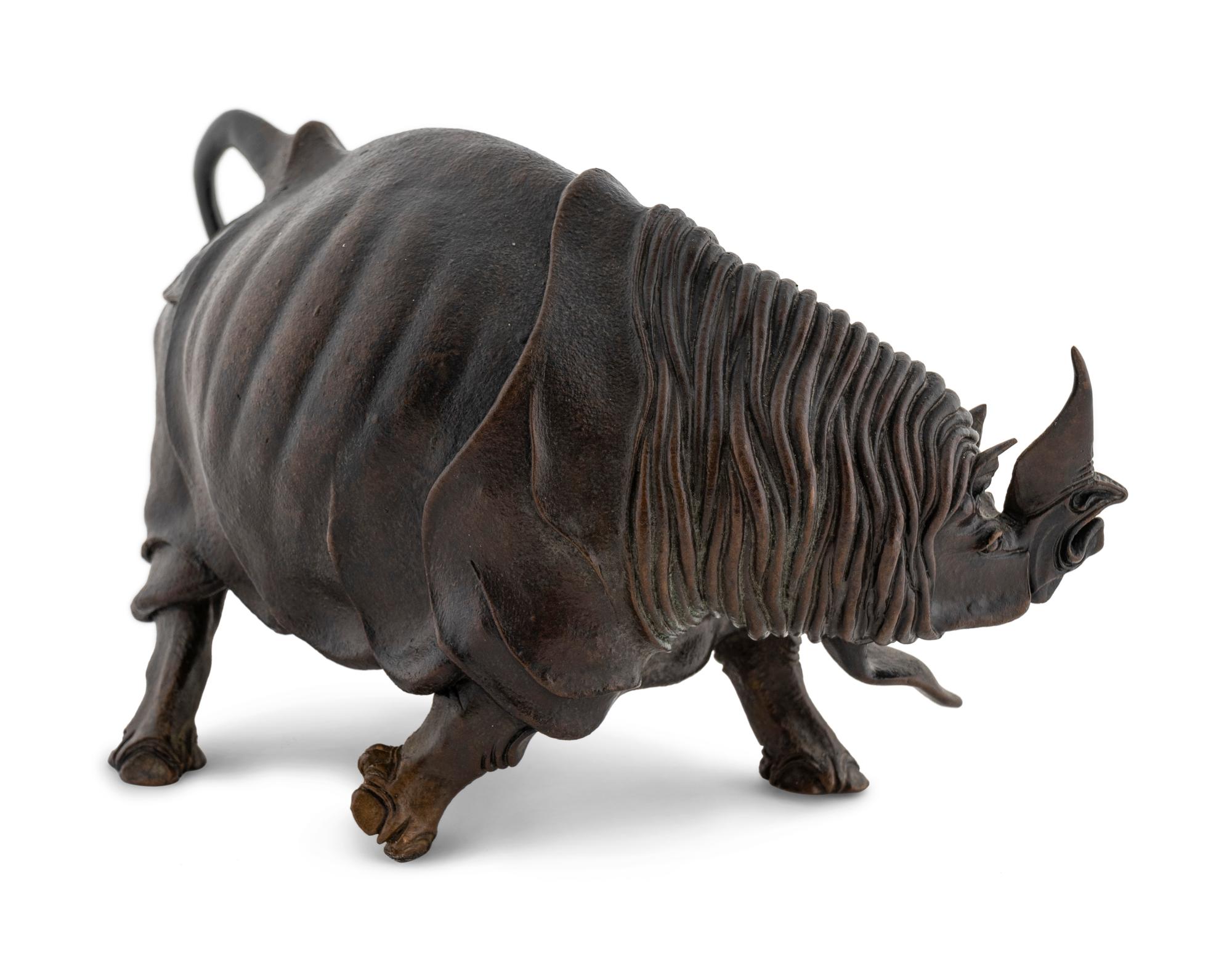 A Bronze Model of a Rhinoceros — 20TH CENTURY