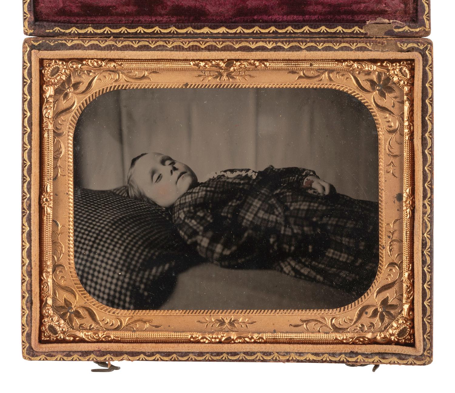 [EARLY PHOTOGRAPHY]. Quarter plate postmortem ruby ambrotype of a young child.