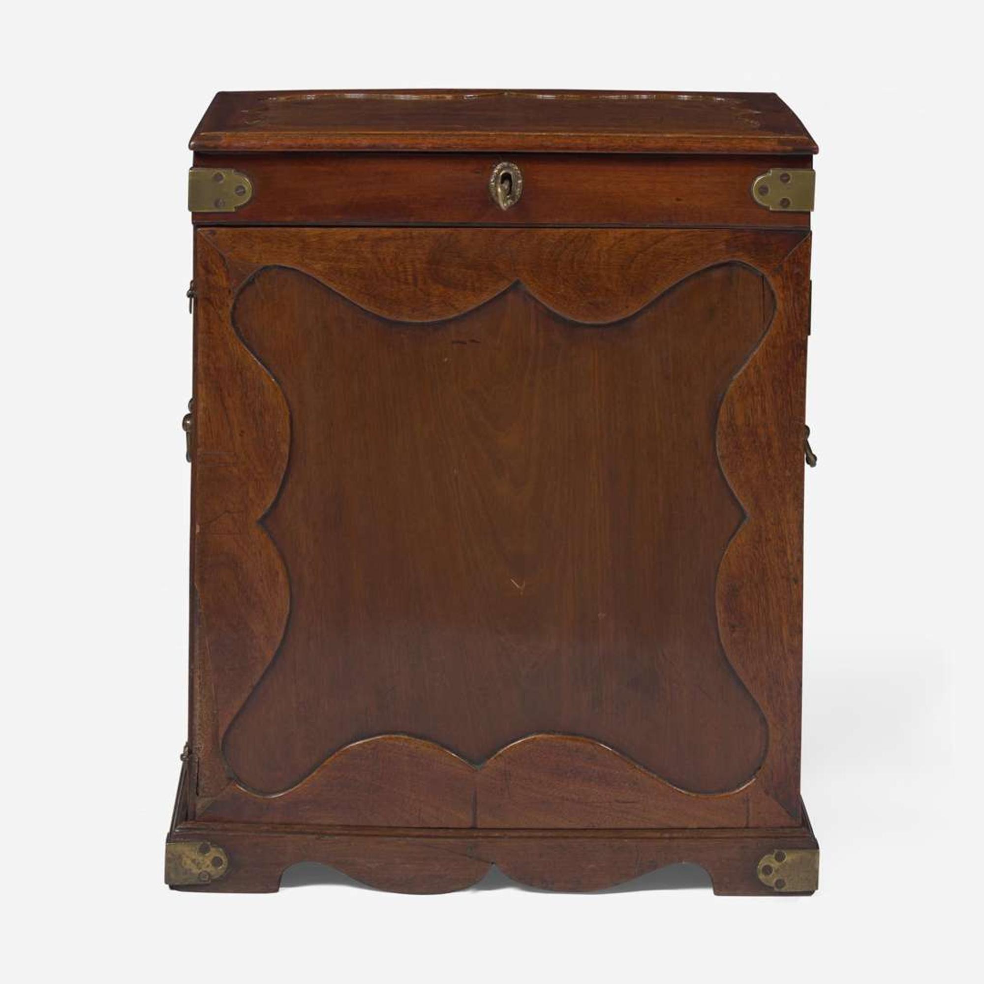 A George II carved mahogany apothecary cabinet circa 1740