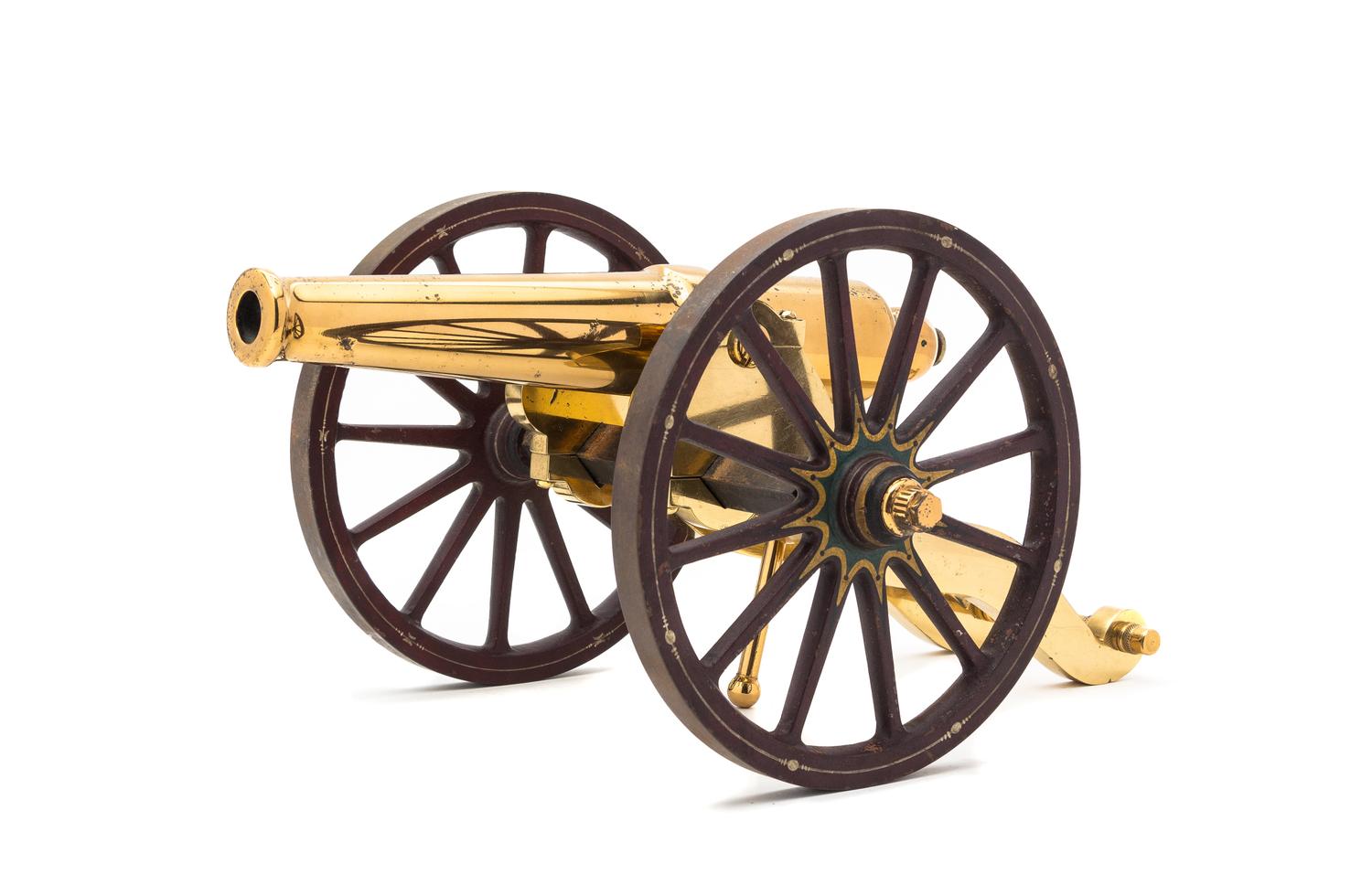 A Brass and Iron Model of a Cannon, Length 19 inches.