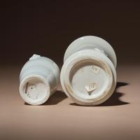 Two Chinese Blanc-de-Chine Porcelain Vases, 17th-18th Century — 清中期 德化白瓷雙輔首耳筒瓶及花觚