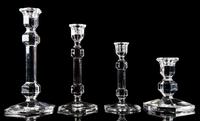 A Group of Four Glass Candlesticks Height of tallest 9 1/2 inches. — RETAILED BY TIFFANY & CO.