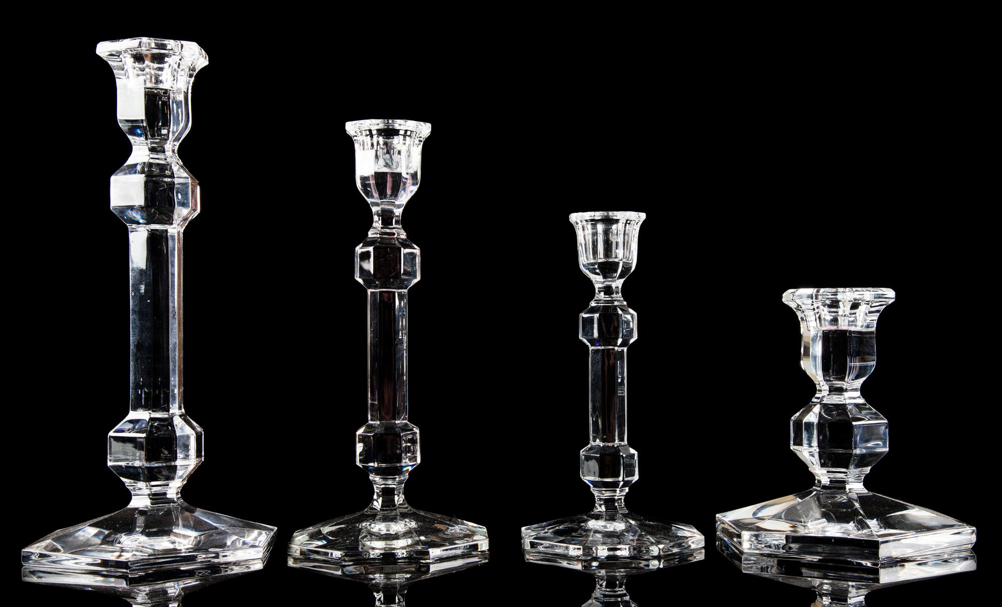 A Group of Four Glass Candlesticks Height of tallest 9 1/2 inches. — RETAILED BY TIFFANY & CO.