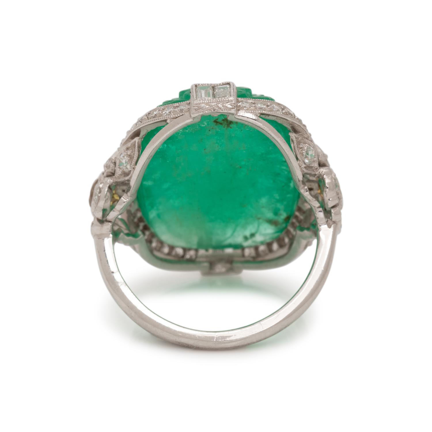 CARVED EMERALD, DIAMOND AND COLORED DIAMOND RING