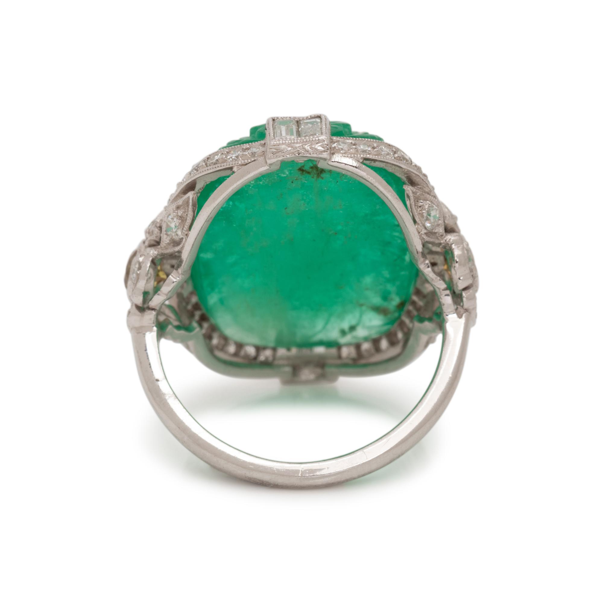 CARVED EMERALD, DIAMOND AND COLORED DIAMOND RING