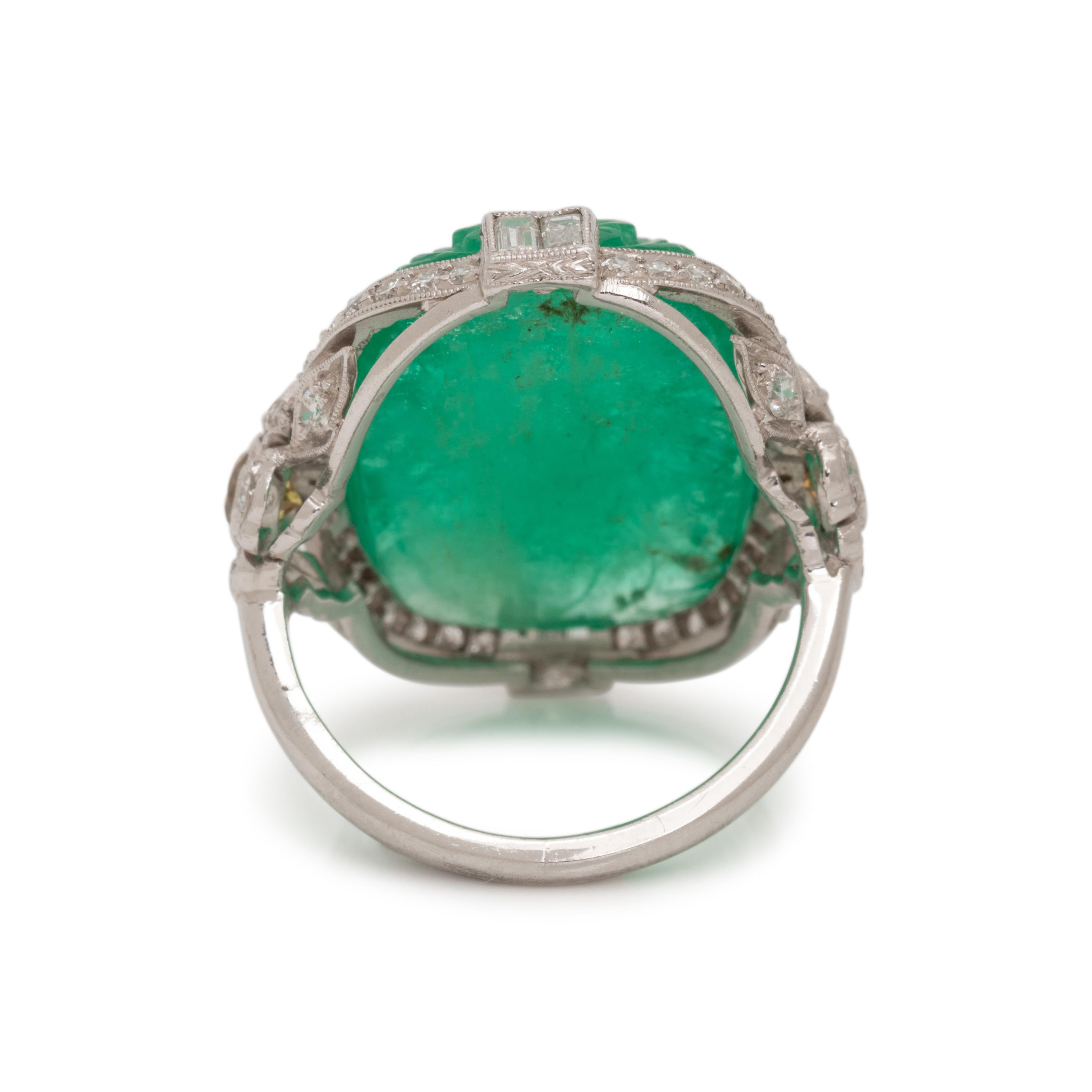 CARVED EMERALD, DIAMOND AND COLORED DIAMOND RING